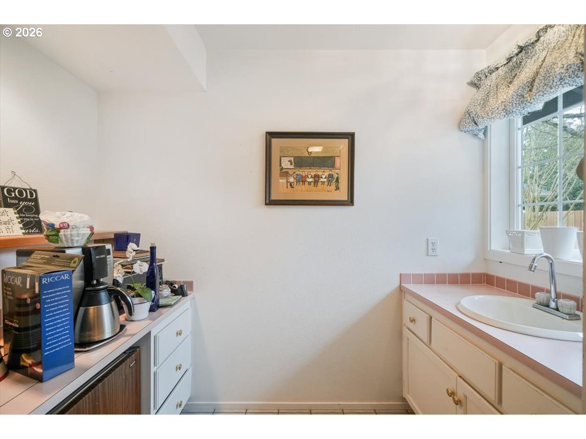 1376 Brickley Road Eugene, OR 97401 - Photo 44 of 48 a kitchen with a sink cabinets and appliances