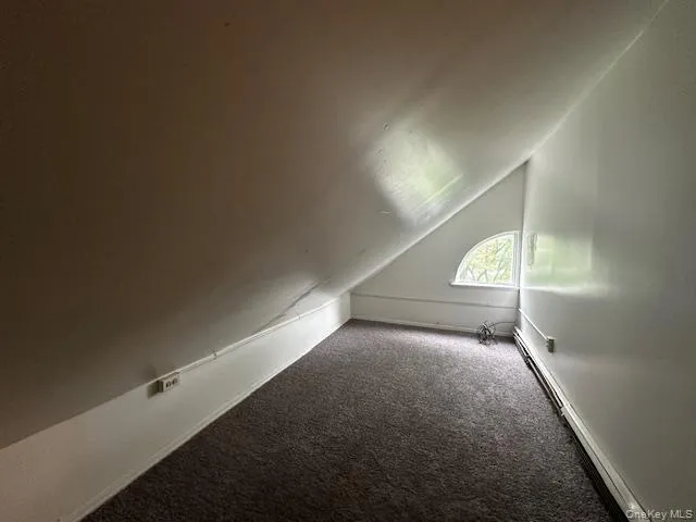 a view of a room with stairs and a window