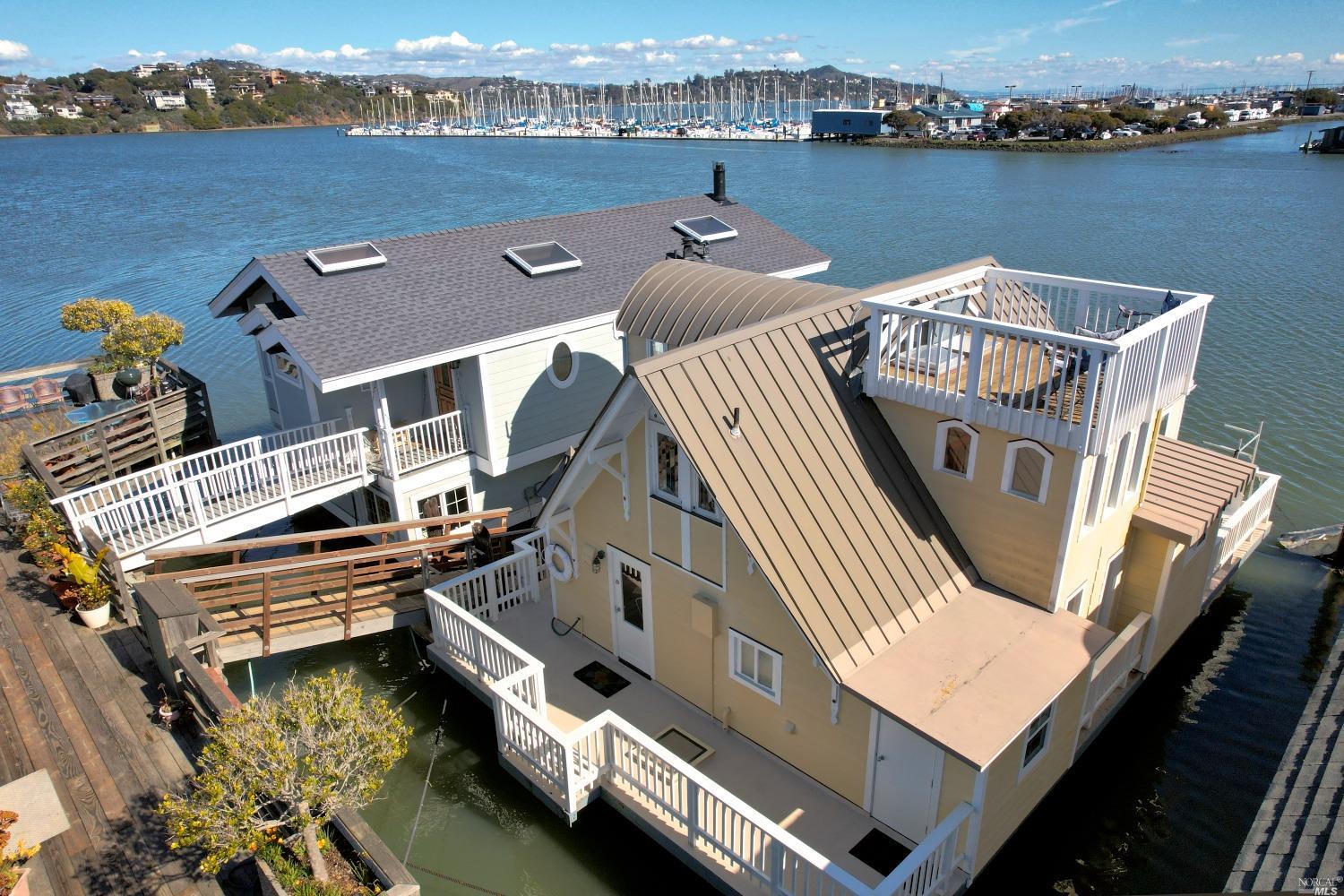 an aerial view of a house with lake view