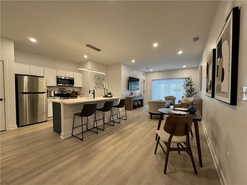 601 Erie Rdg Drive Henrietta, NY 14467 - Photo 3 of 12 Typical great room view including living space, di