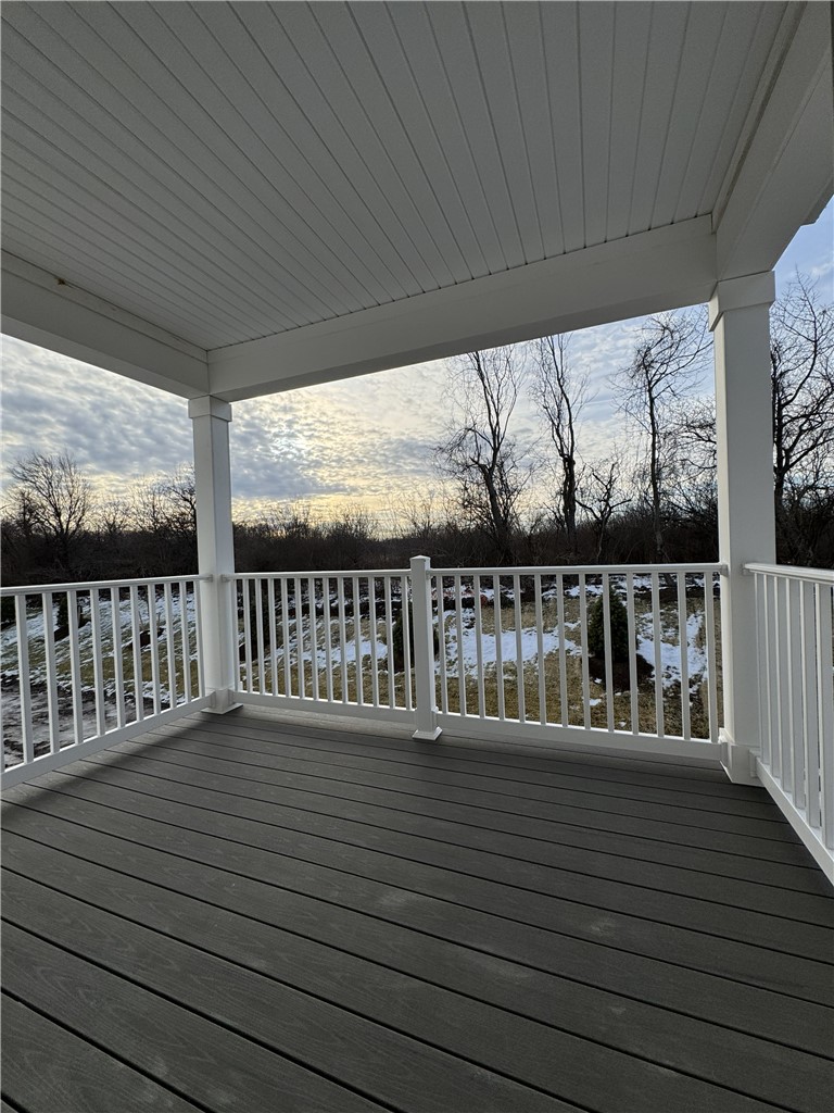 601 Erie Rdg Drive Henrietta, NY 14467 - Photo 9 of 12 Typical covered balcony facing south towards woode