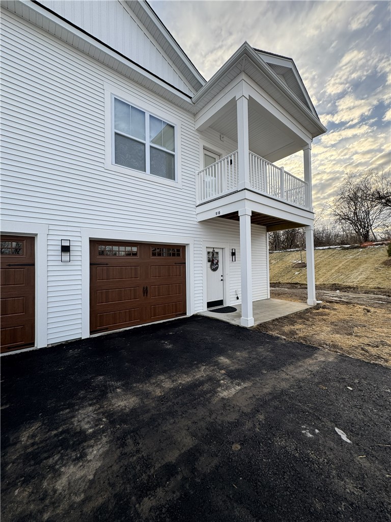 601 Erie Rdg Drive Henrietta, NY 14467 - Photo 10 of 12 Typical exterior entrance