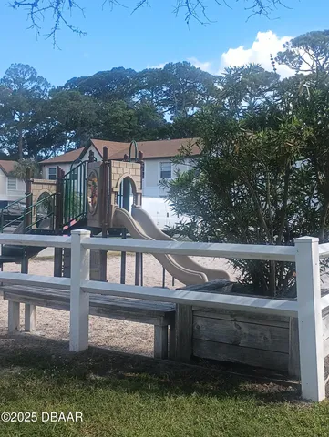 a view of house with a yard