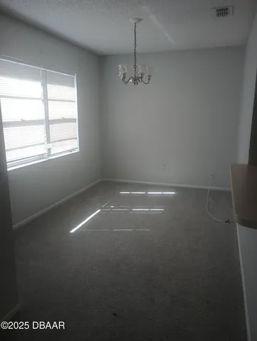 a view of empty room with windows