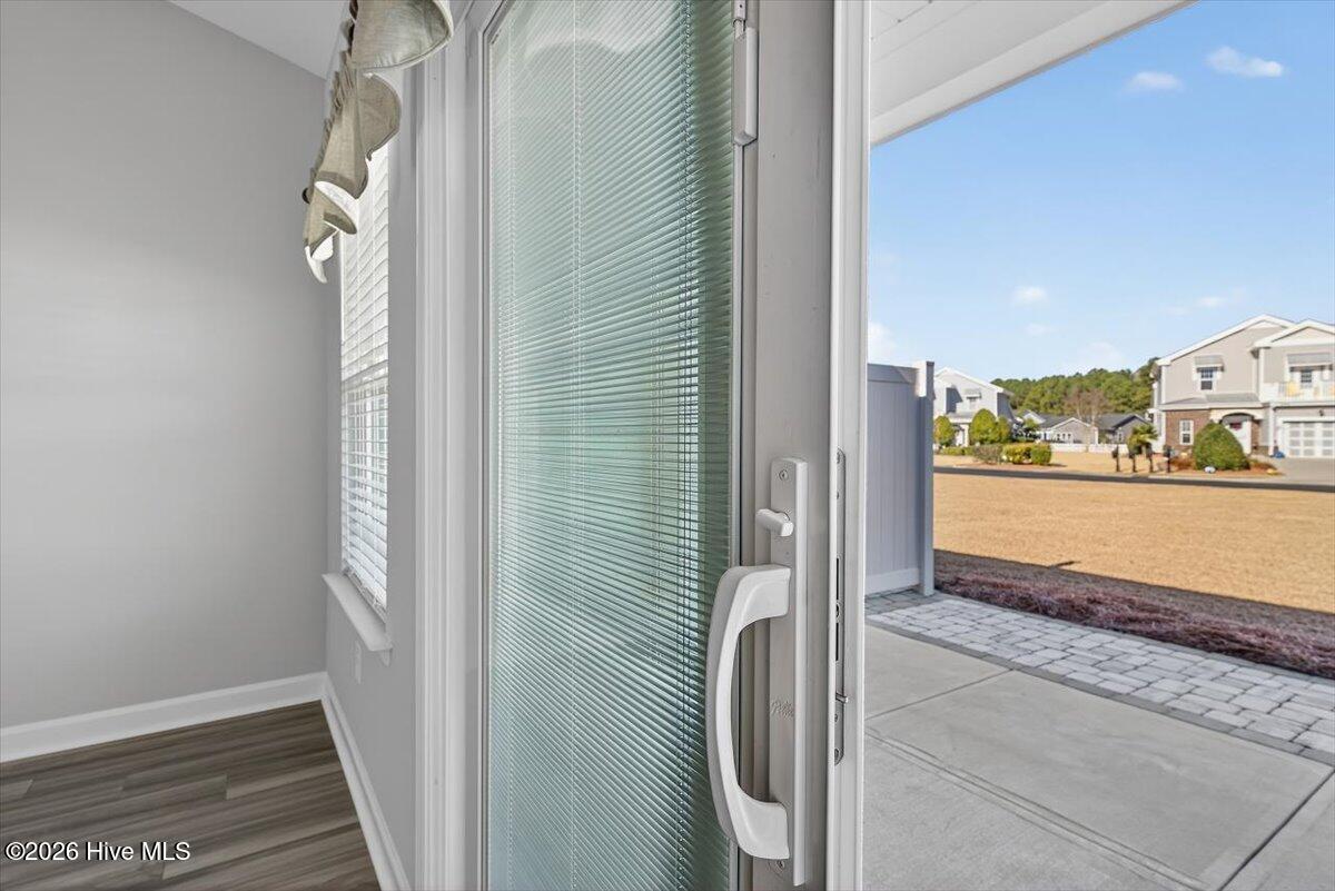 8840 Radcliff Drive Northwest Calabash, NC 28467 - Photo 19 of 54 Updated slider door opens to backyard patio space.