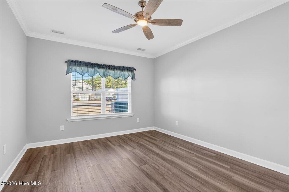 8840 Radcliff Drive Northwest Calabash, NC 28467 - Photo 22 of 54 Primary bedroom retreat featuring ample space, natural light, and a calm, relaxing layout.