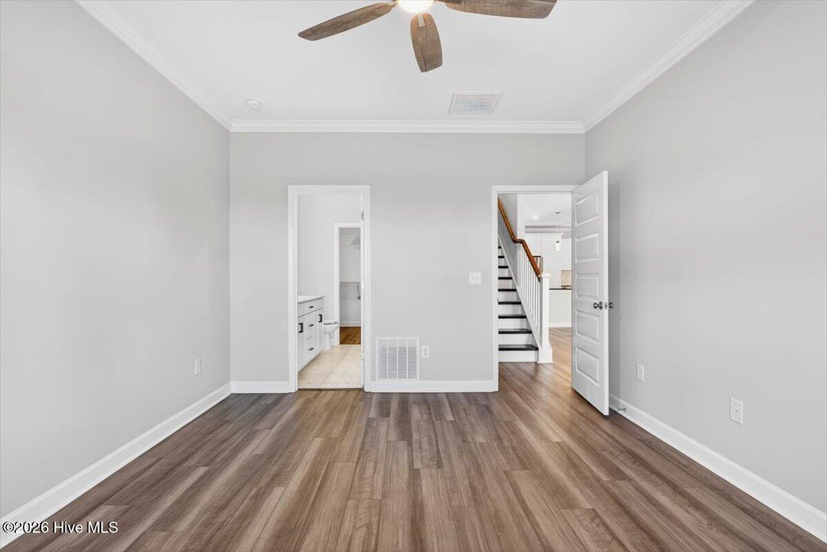 8840 Radcliff Drive Northwest Calabash, NC 28467 - Photo 23 of 54 Another view of the primary bedroom with great proportions and room for a full furniture set.