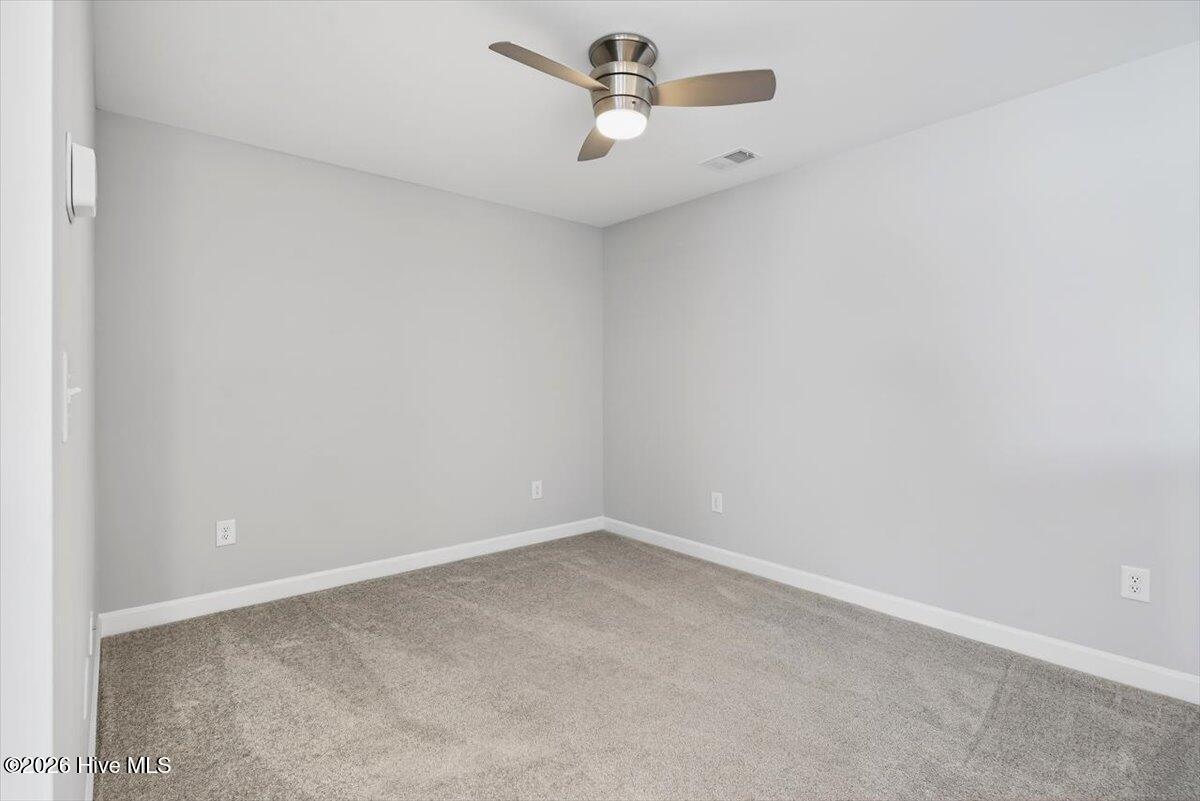 8840 Radcliff Drive Northwest Calabash, NC 28467 - Photo 33 of 54 Spacious additional living area with great natural light and versatile use options.