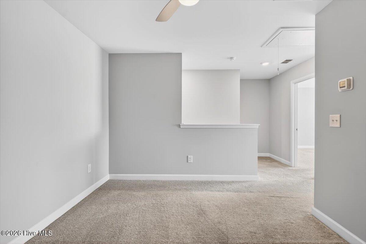 8840 Radcliff Drive Northwest Calabash, NC 28467 - Photo 34 of 54 Another view of the bonus space—perfect for entertaining, relaxing, or multi-purpose living.