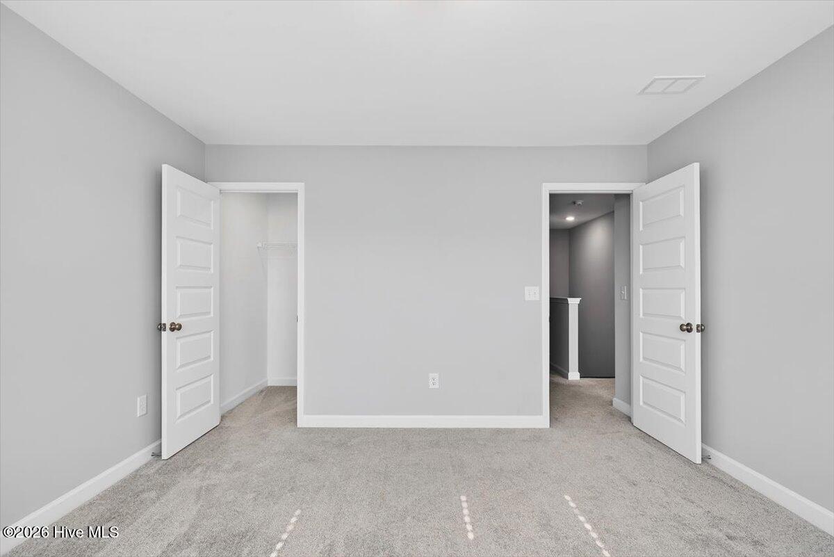 8840 Radcliff Drive Northwest Calabash, NC 28467 - Photo 37 of 54 Bright bedroom offering flexibility for guests, work-from-home, or hobbies.