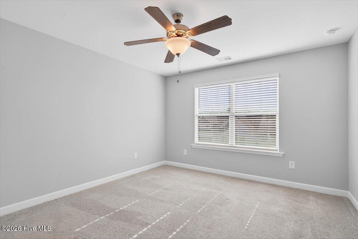 8840 Radcliff Drive Northwest Calabash, NC 28467 - Photo 38 of 54 Third bedroom space with phenomenal natural lighting.