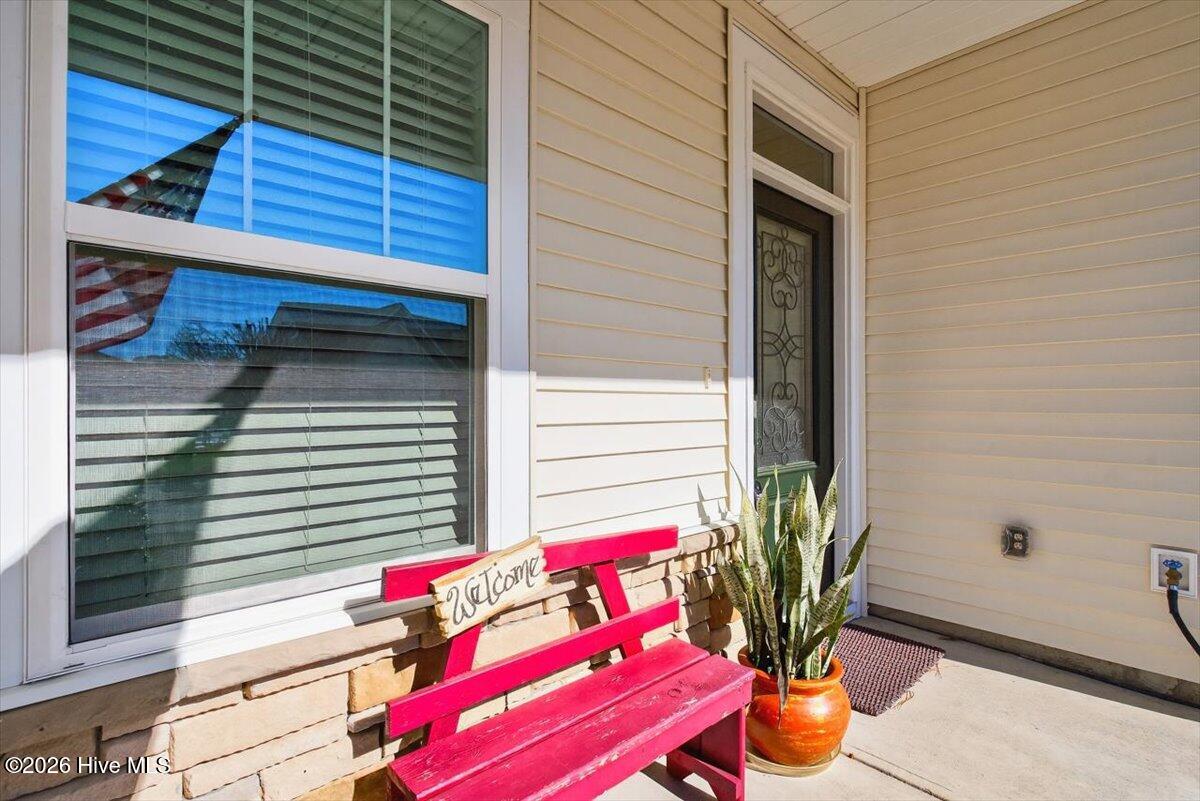 8840 Radcliff Drive Northwest Calabash, NC 28467 - Photo 4 of 54 Front porch of the home with space to enjoy the outdoors.