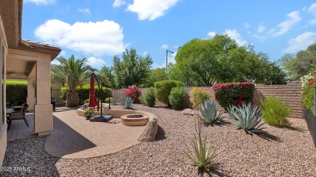 a view of a backyard and patio