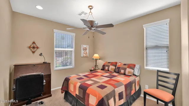 a bedroom with a bed and a fireplace