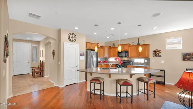 a view of a dining room with furniture and wooden floor