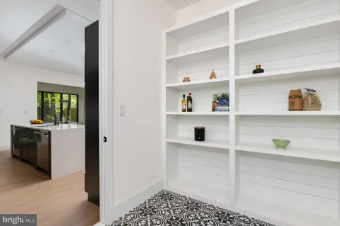 a view of bathroom with a sink and mirror