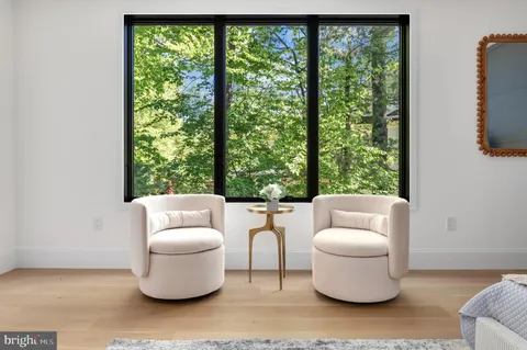 a spacious bathroom with a double vanity sink a mirror and a bathtub