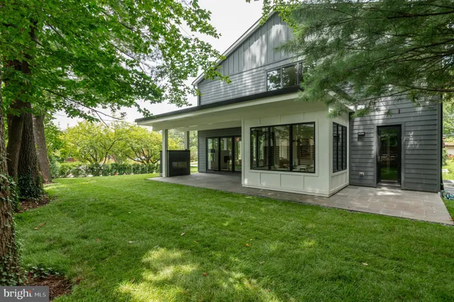 a view of a backyard with large tree