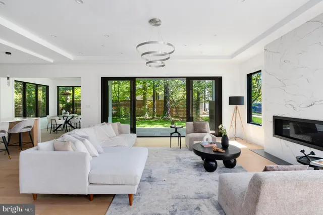 a living room with furniture fireplace and flat screen tv