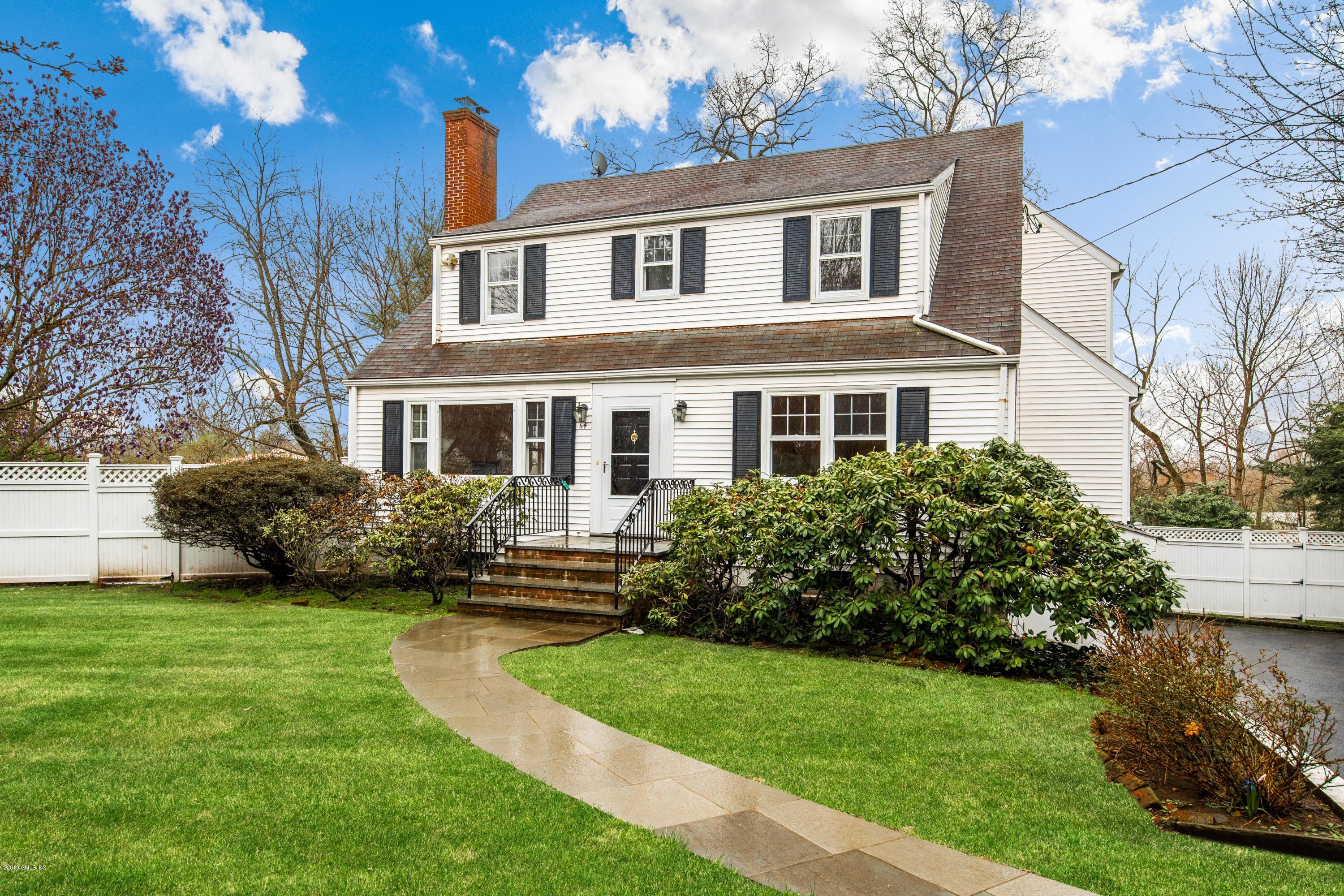 64 Wesskum Wood Road Riverside, CT 06878 - Photo 13 of 13 a front view of a house with a garden