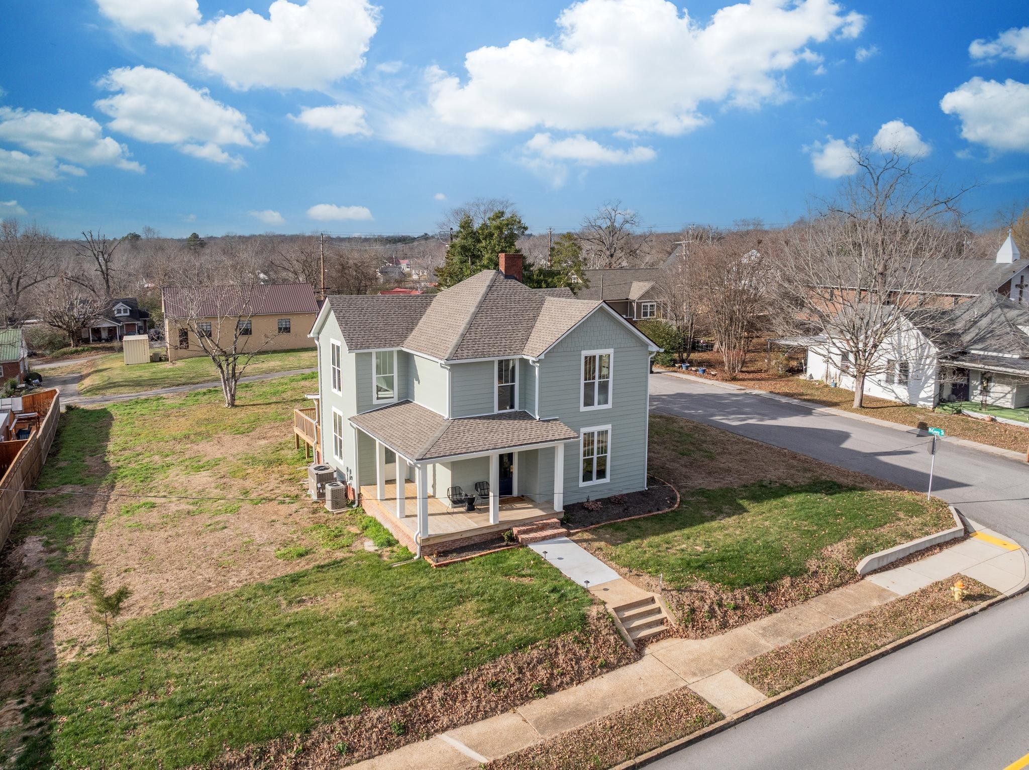 a aerial view of a house with a yard