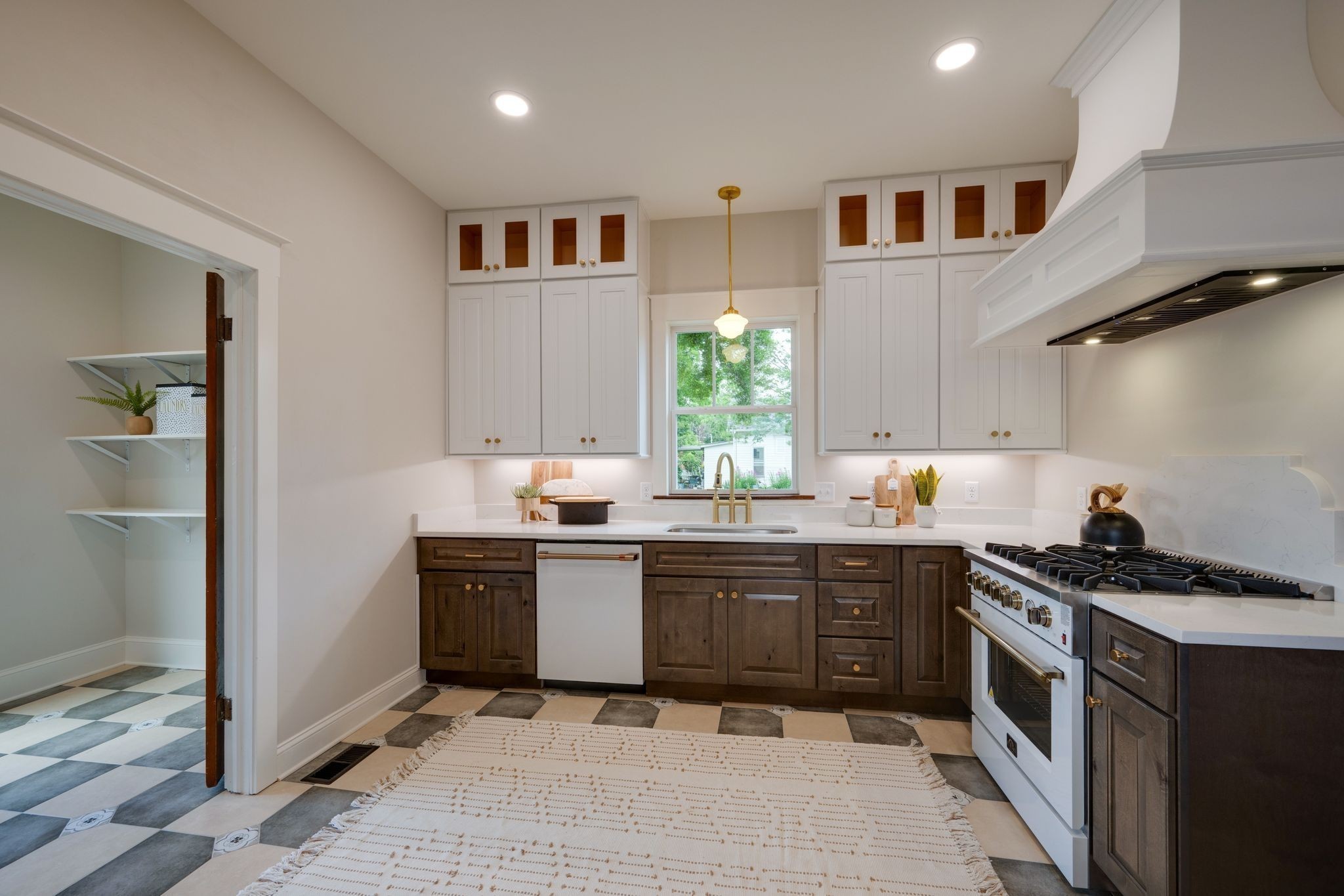 414 West College Street Dickson, TN 37055 - Photo 14 of 53 a kitchen with stainless steel appliances granite countertop a stove a sink and a refrigerator