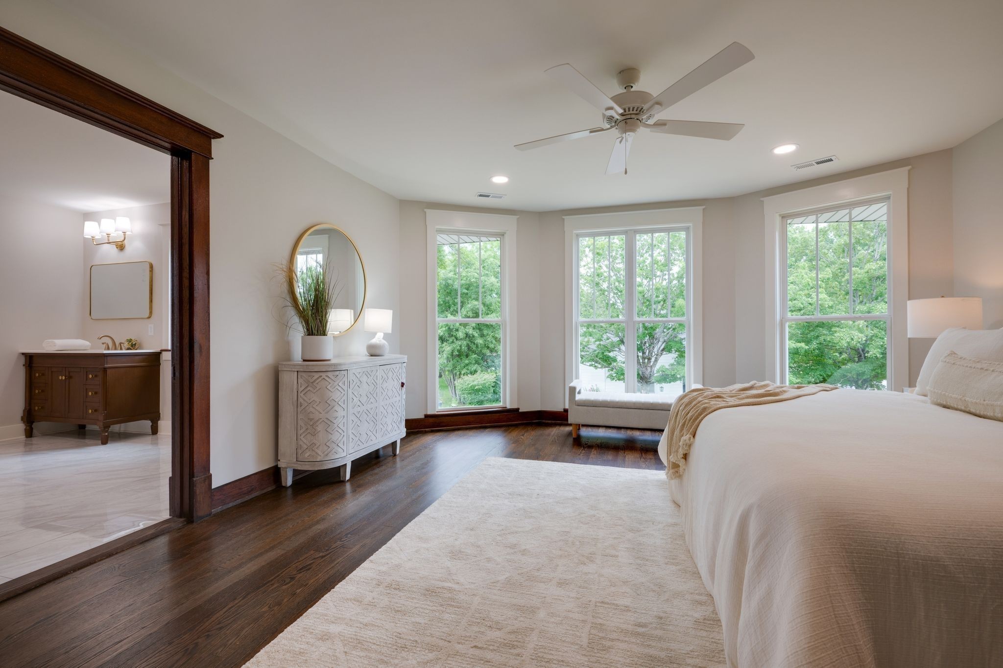 414 West College Street Dickson, TN 37055 - Photo 20 of 53 a spacious bedroom with a large bed and a chandelier