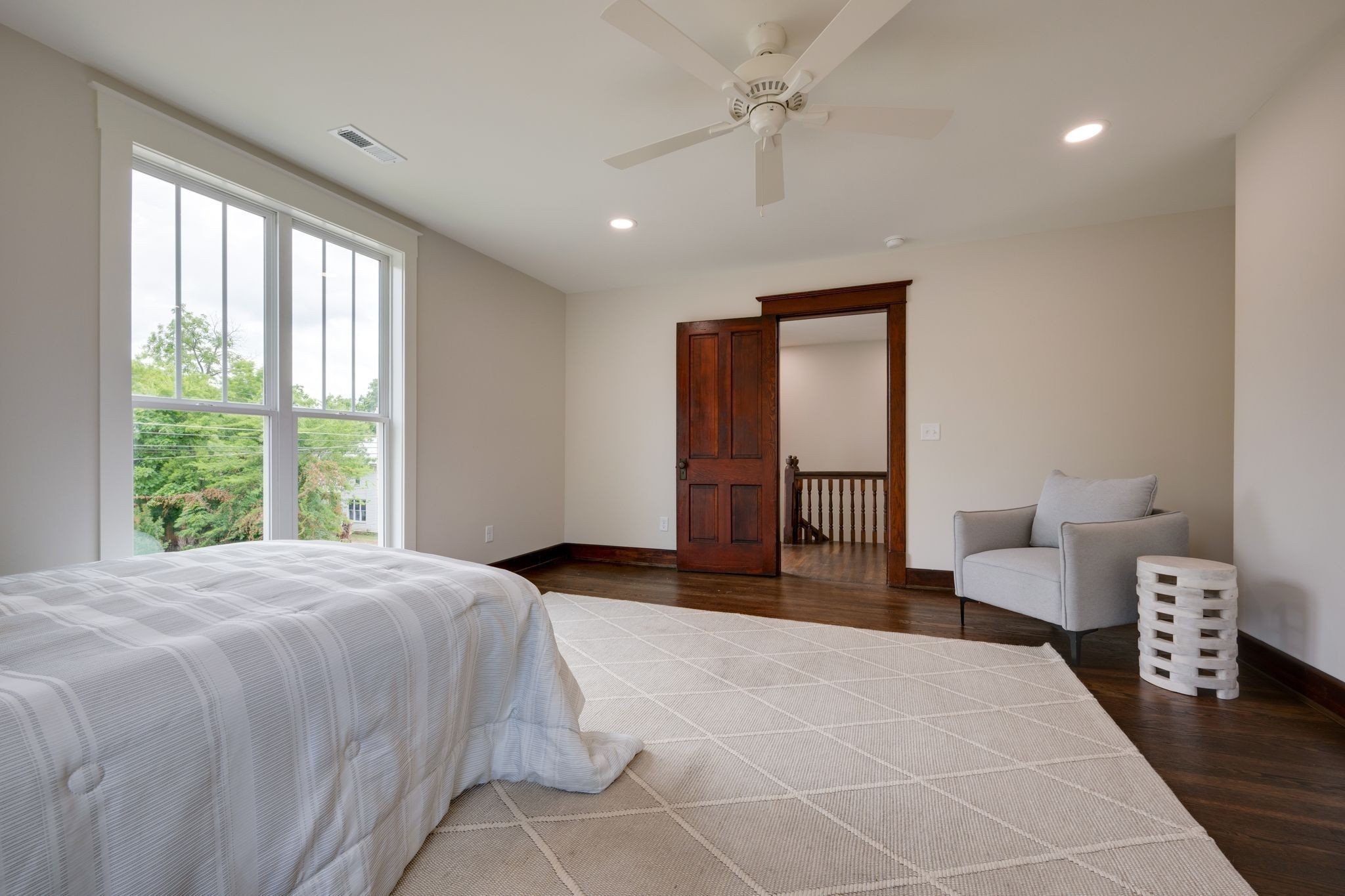 414 West College Street Dickson, TN 37055 - Photo 28 of 53 a spacious bedroom with a large bed and a large window