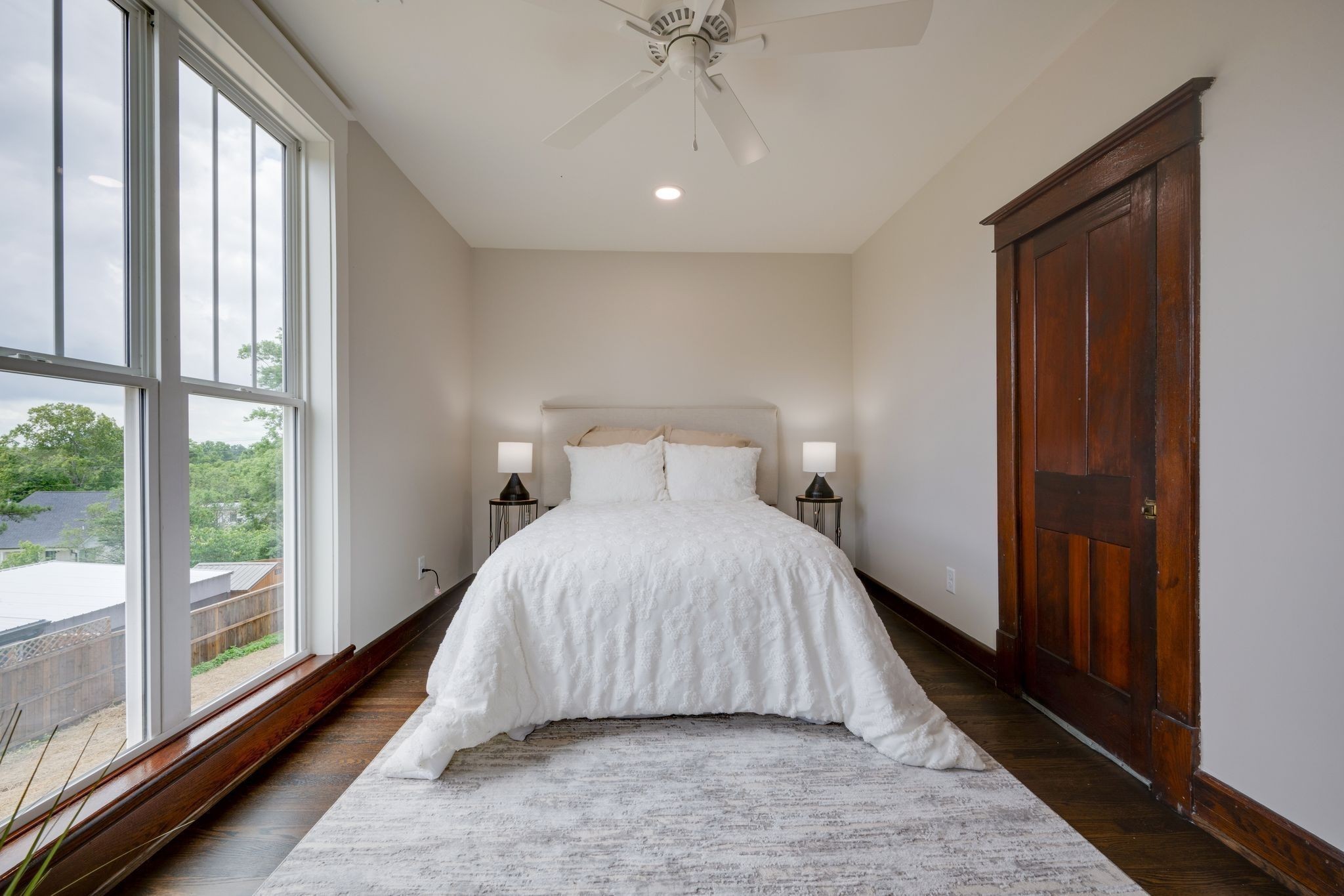 414 West College Street Dickson, TN 37055 - Photo 30 of 53 a bed sitting in a bedroom next to a window