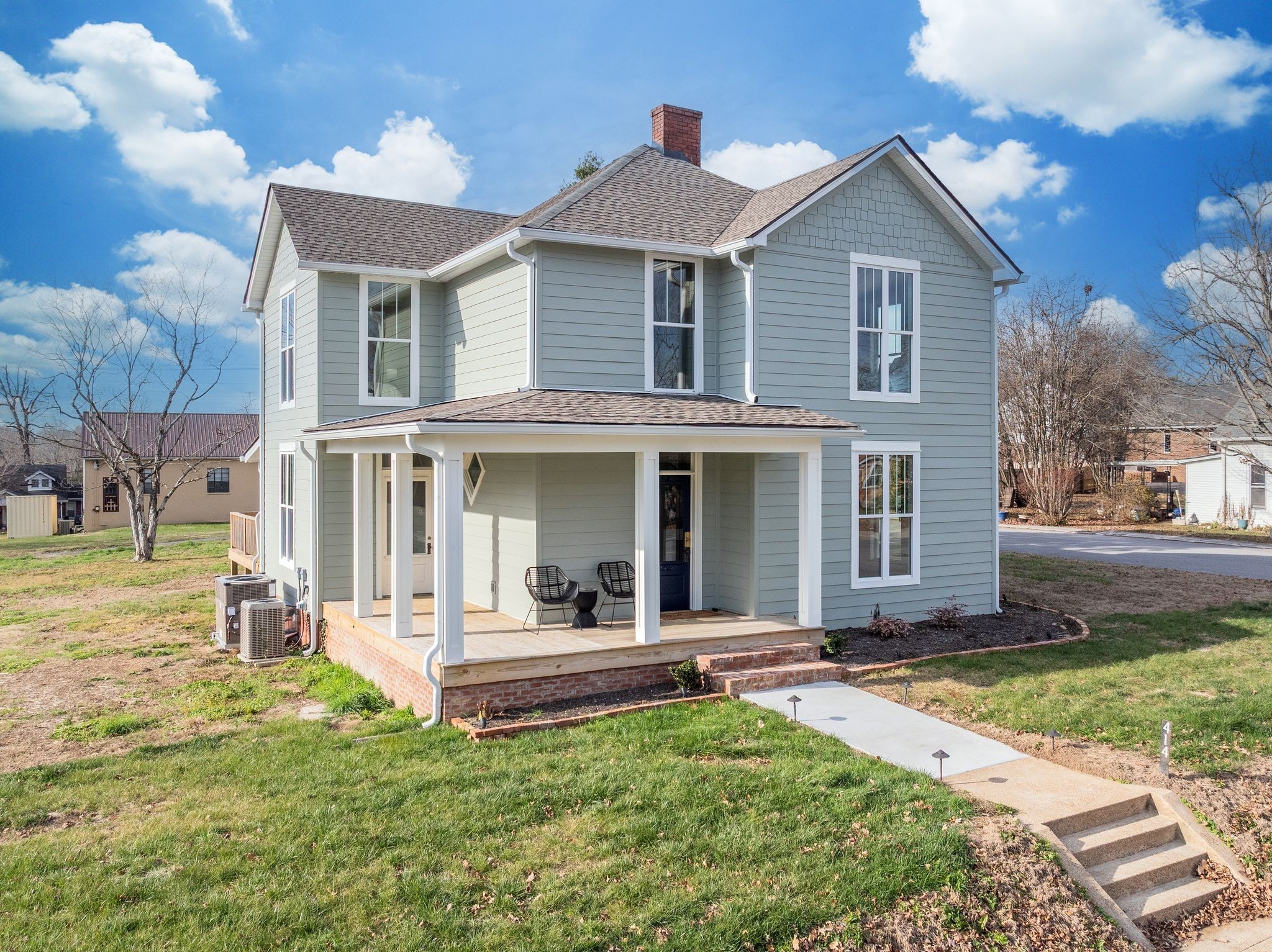 414 West College Street Dickson, TN 37055 - Photo 3 of 53 a front view of a house with a yard