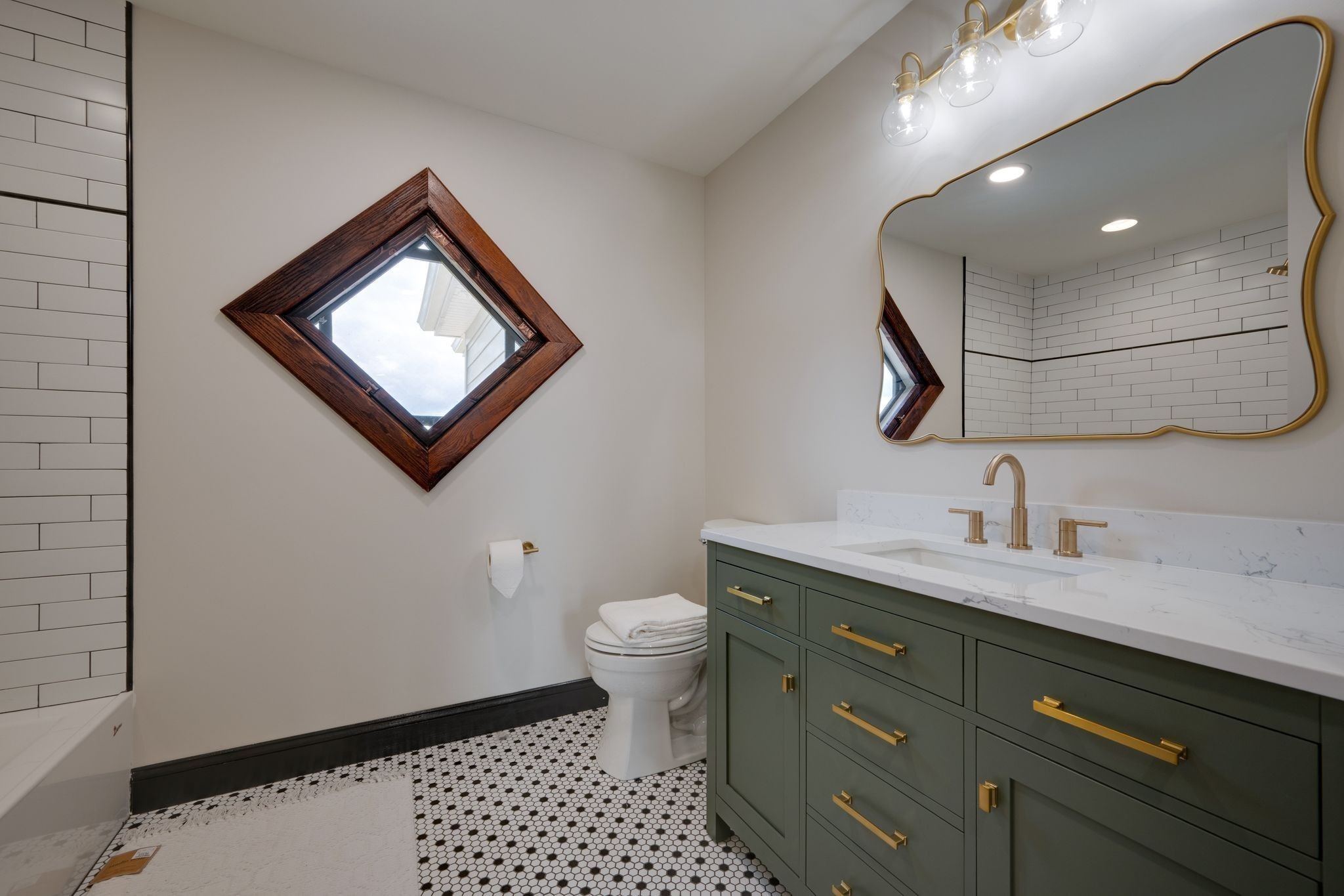 414 West College Street Dickson, TN 37055 - Photo 32 of 53 a bathroom with a toilet a sink and mirror