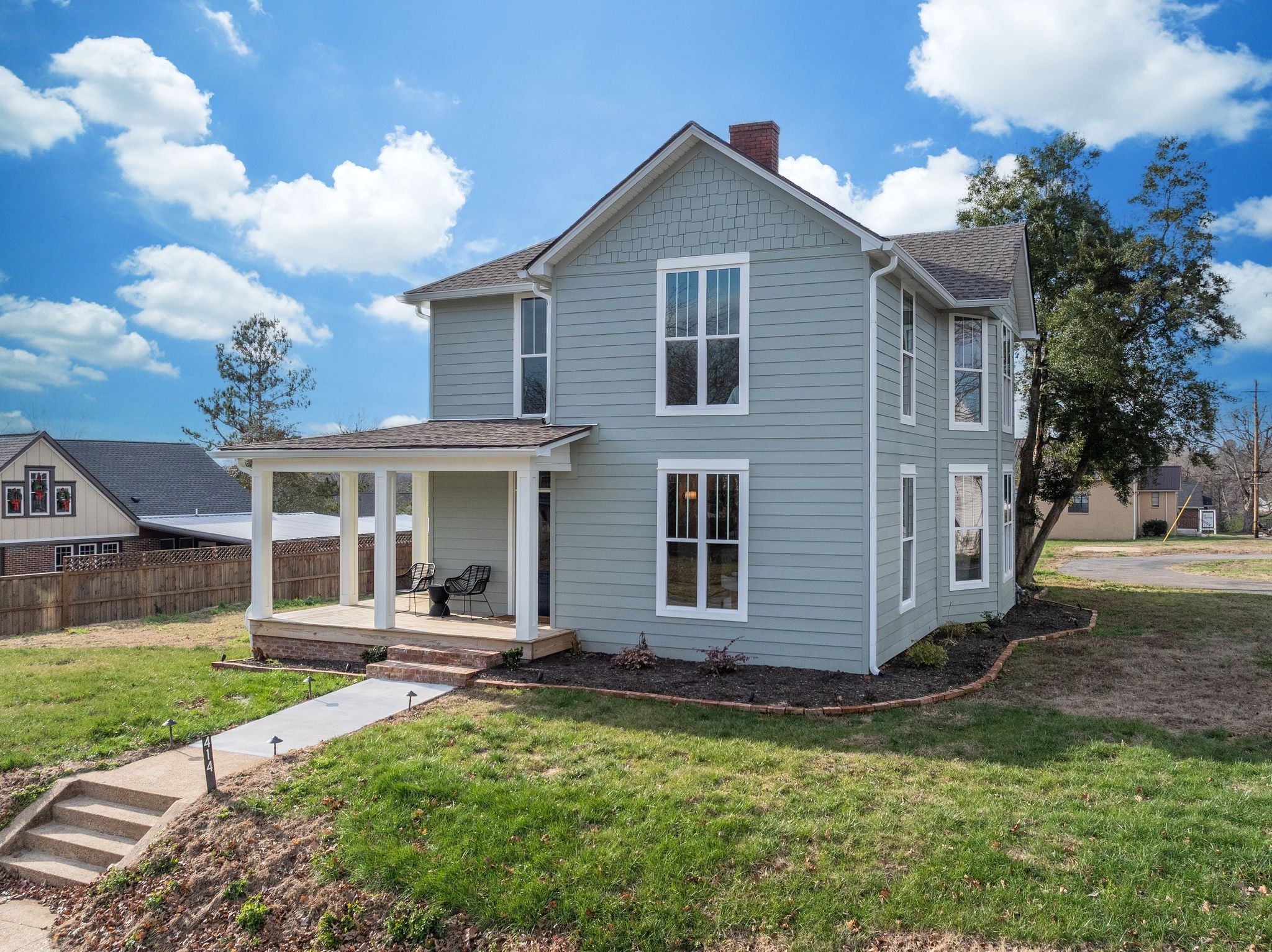 414 West College Street Dickson, TN 37055 - Photo 44 of 53 a front view of a house with a yard