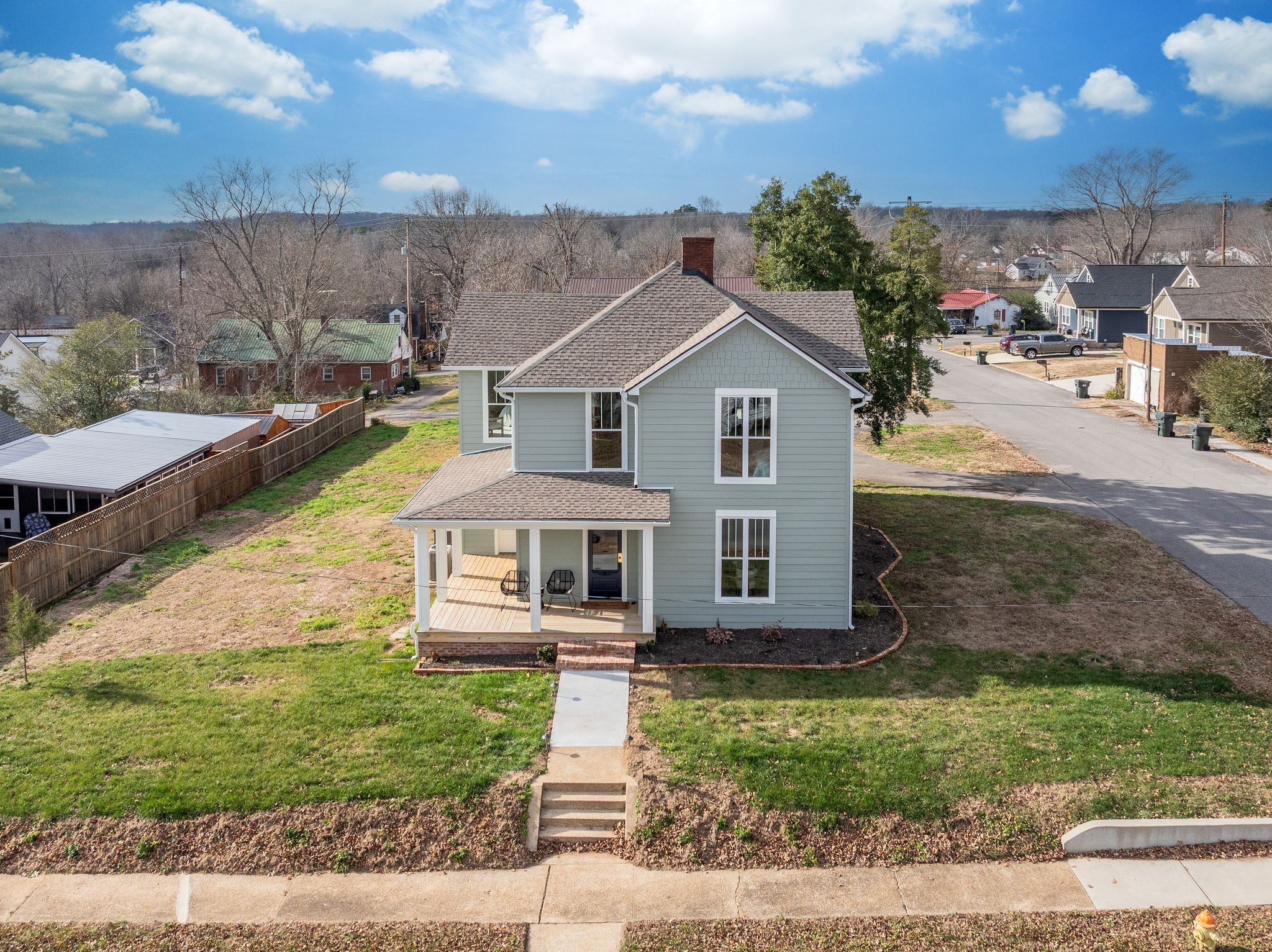 414 West College Street Dickson, TN 37055 - Photo 47 of 53 a view of a big house with a big yard and large trees