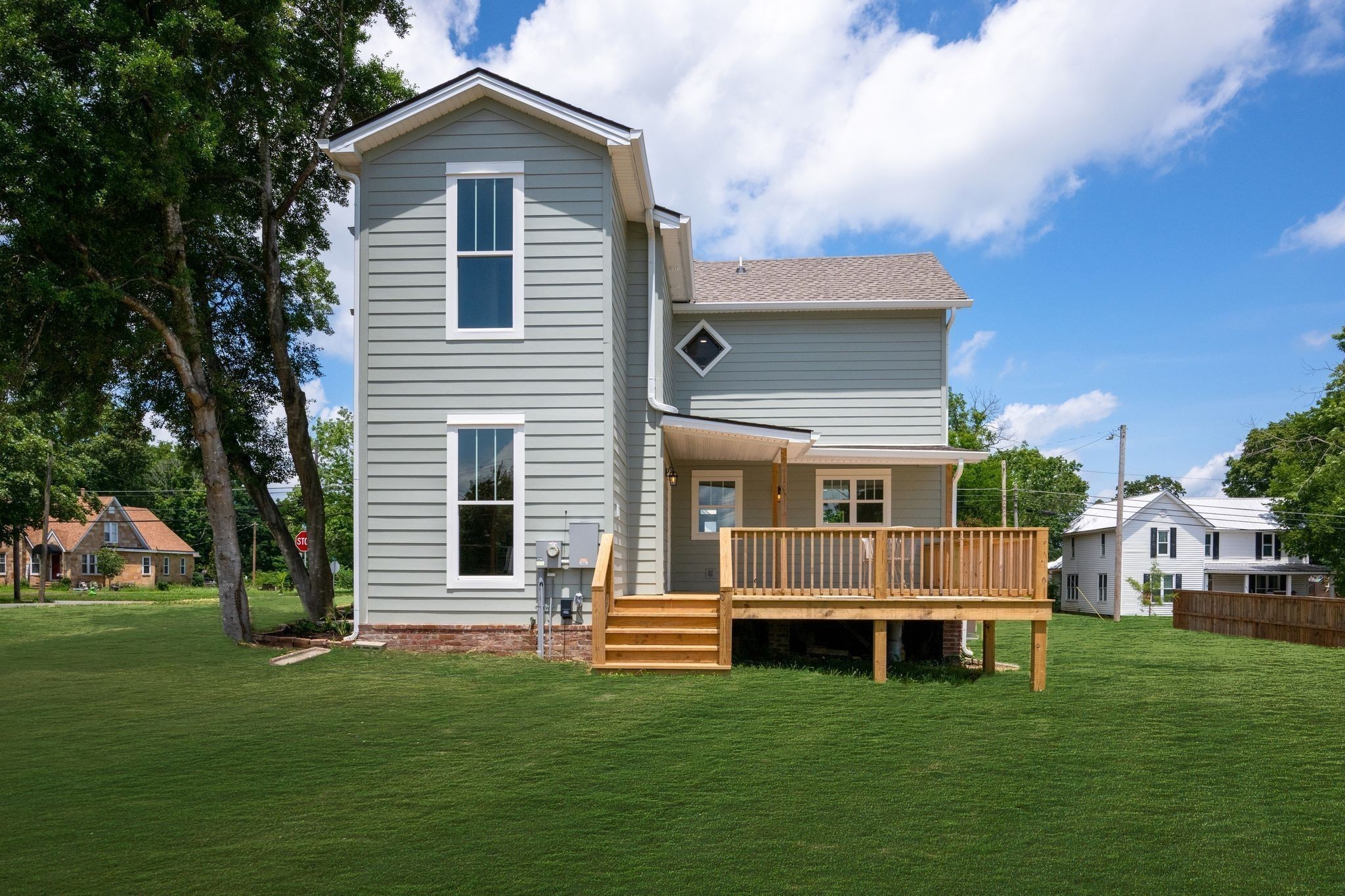 414 West College Street Dickson, TN 37055 - Photo 49 of 53 a front view of a house with a garden