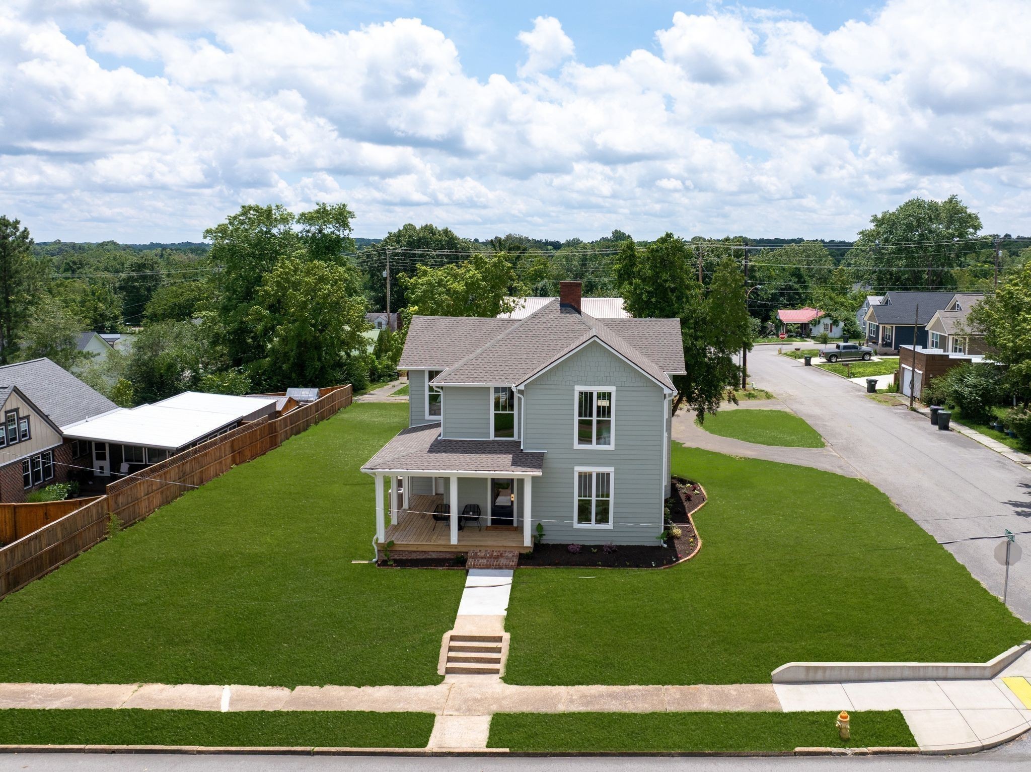 414 West College Street Dickson, TN 37055 - Photo 52 of 53 a aerial view of a house with swimming pool and furniture