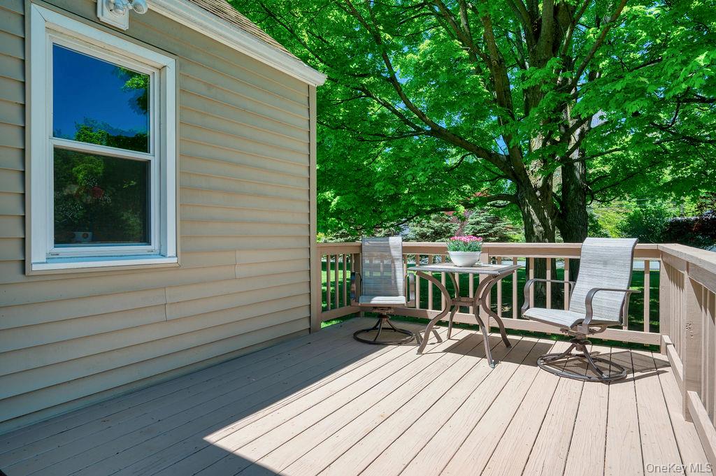 6 Winterberry Road Fishkill, NY 12524 - Photo 4 of 43 Expansive deck featuring wood-finish flooring and sturdy railings, accompanied by a mature tree