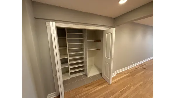 a view of closet area with empty racks