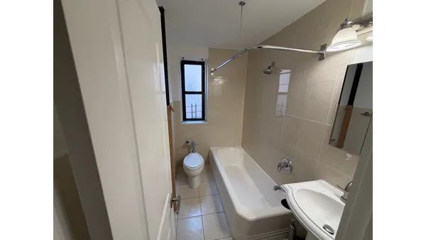 a view of a bathroom with a toilet and a shower