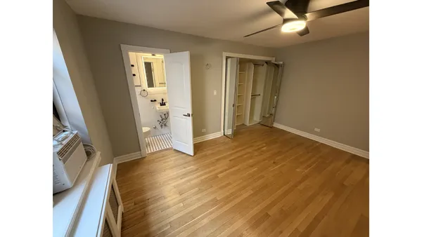 a view of livingroom with hardwood floor and hallway