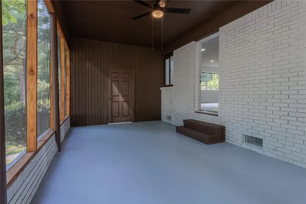 a view of a livingroom with furniture and windows