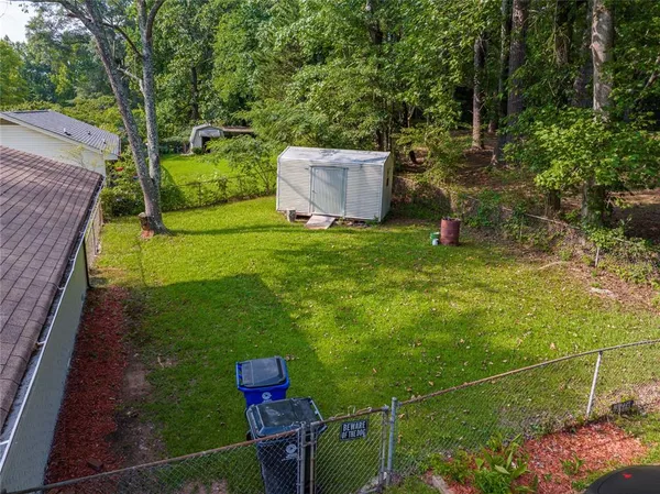 a backyard of a house with lots of green space