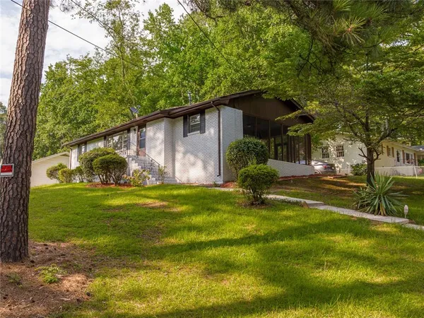 a front view of a house with garden