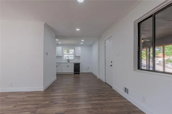 a view of a kitchen with a sink and a window