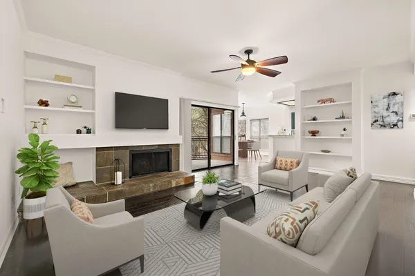 a living room with furniture fireplace and a flat screen tv