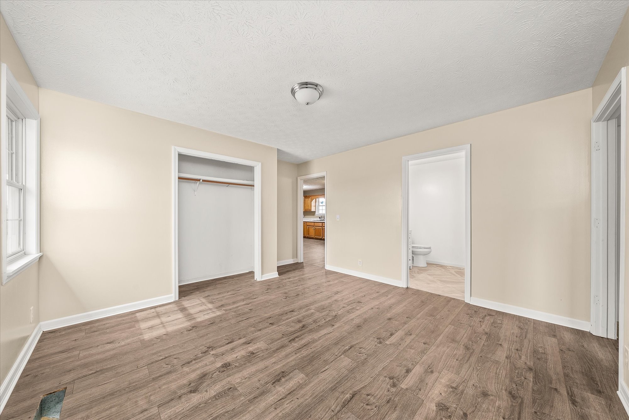 11216 Clay County Highway Moss, TN 38575 - Photo 11 of 40 a view of an empty room with wooden floor and closet