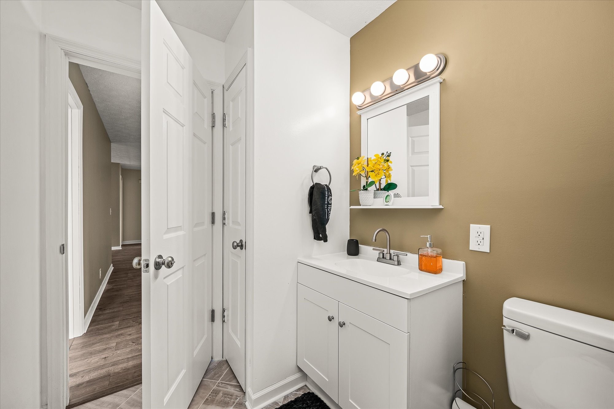 11216 Clay County Highway Moss, TN 38575 - Photo 17 of 40 a bathroom with a sink vanity mirror and toilet