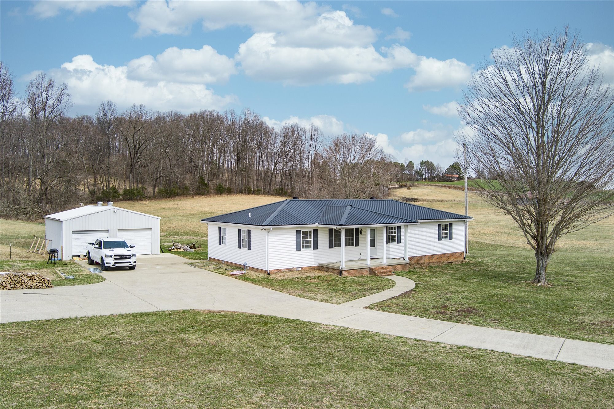 11216 Clay County Highway Moss, TN 38575 - Photo 2 of 40 a view of a house with a big yard and large trees