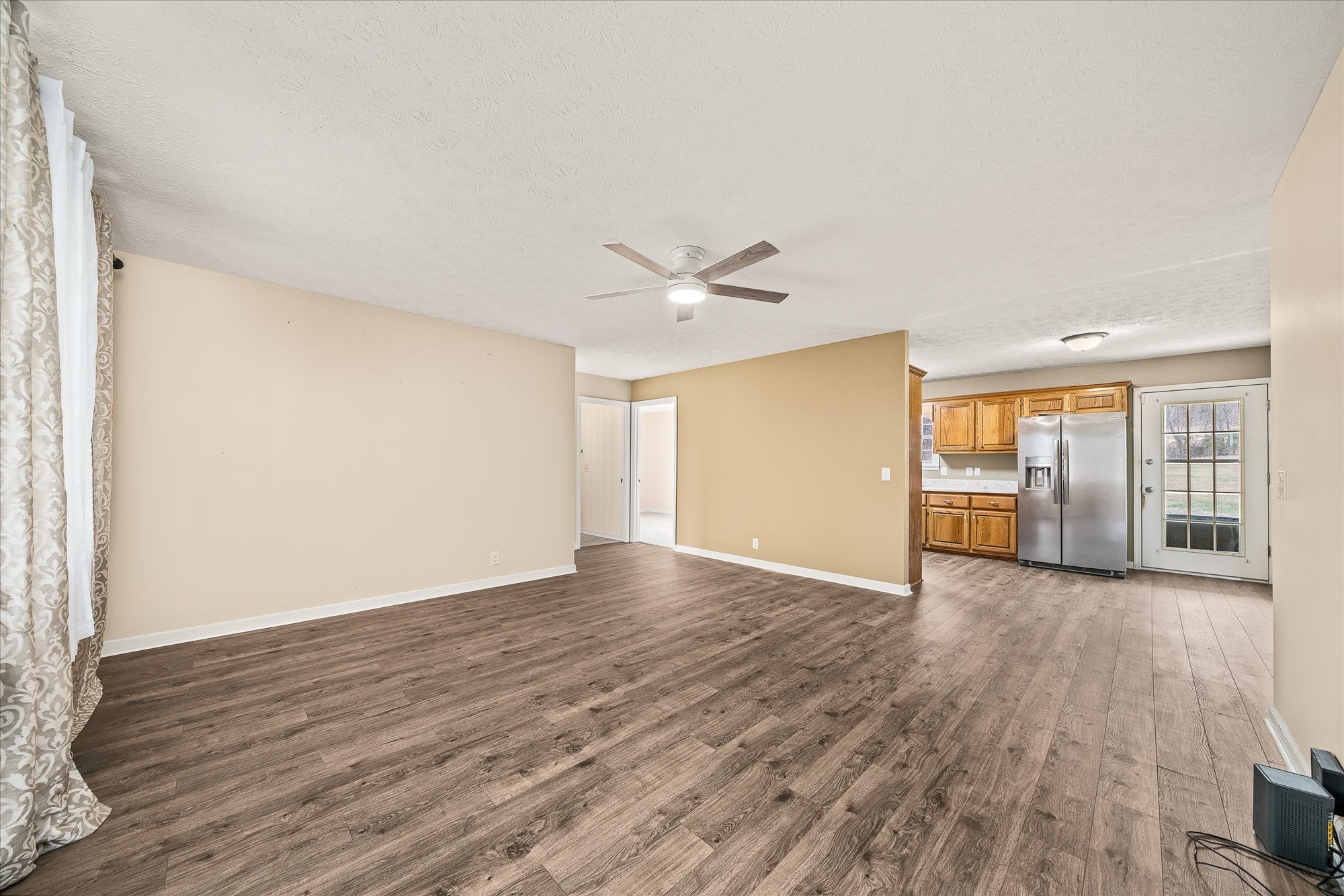 11216 Clay County Highway Moss, TN 38575 - Photo 5 of 40 a view of an empty room with wooden floor and a window