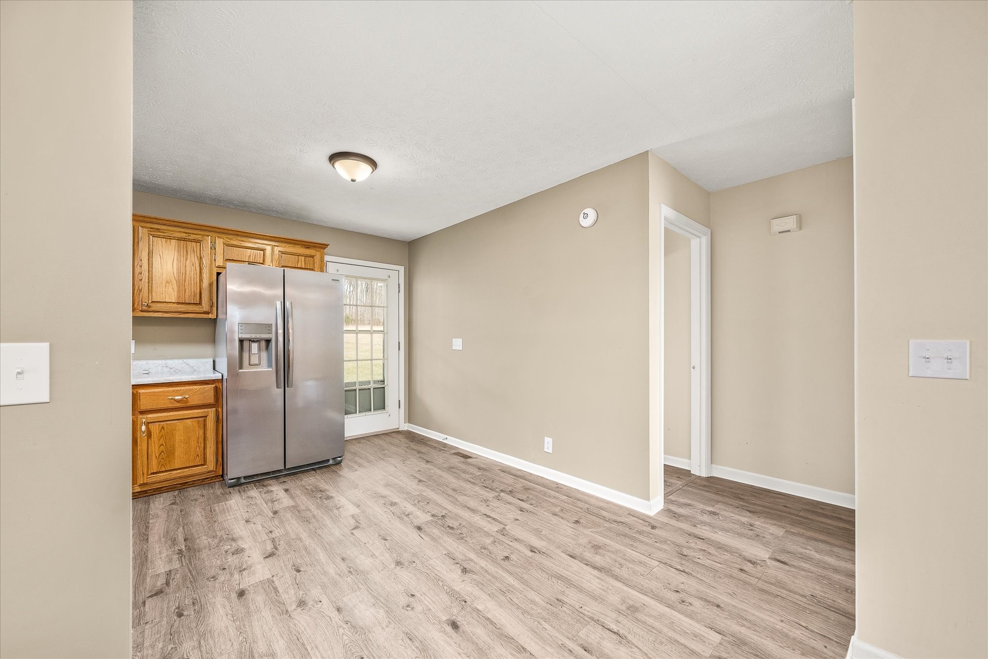11216 Clay County Highway Moss, TN 38575 - Photo 6 of 40 a view of an empty room with window and wooden floor