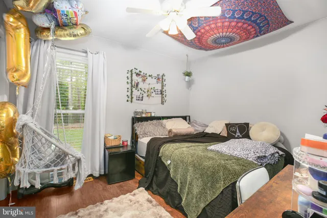 a bedroom with bed and a window